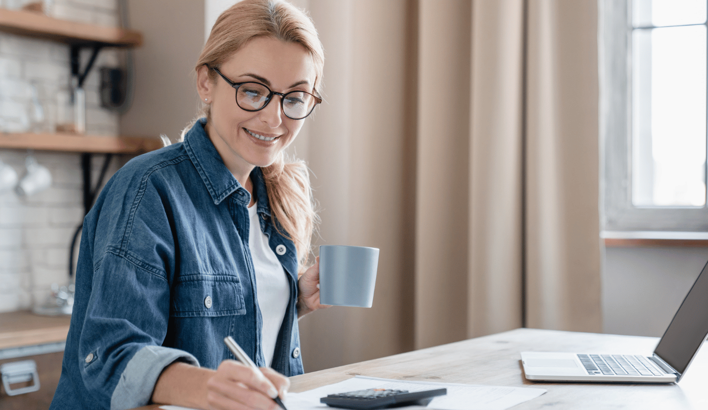 woman smiling holding coffee