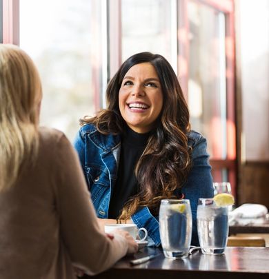 Woman smiling in a restaurant