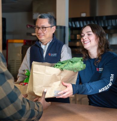 employees handing out food at food pantry
